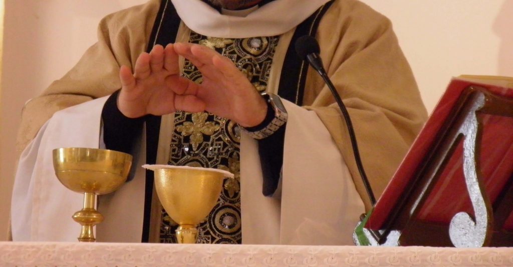 Priest Consecrating the Gifts at Mass
